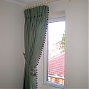 A single trimmed double pleat curtain