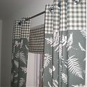Roman blind and trimmed eyelet curtains